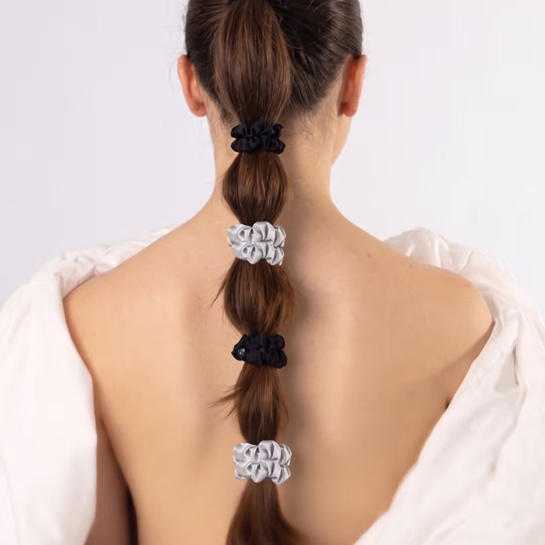 Bubble ponytail styled with small silver and black organic silk scrunchies