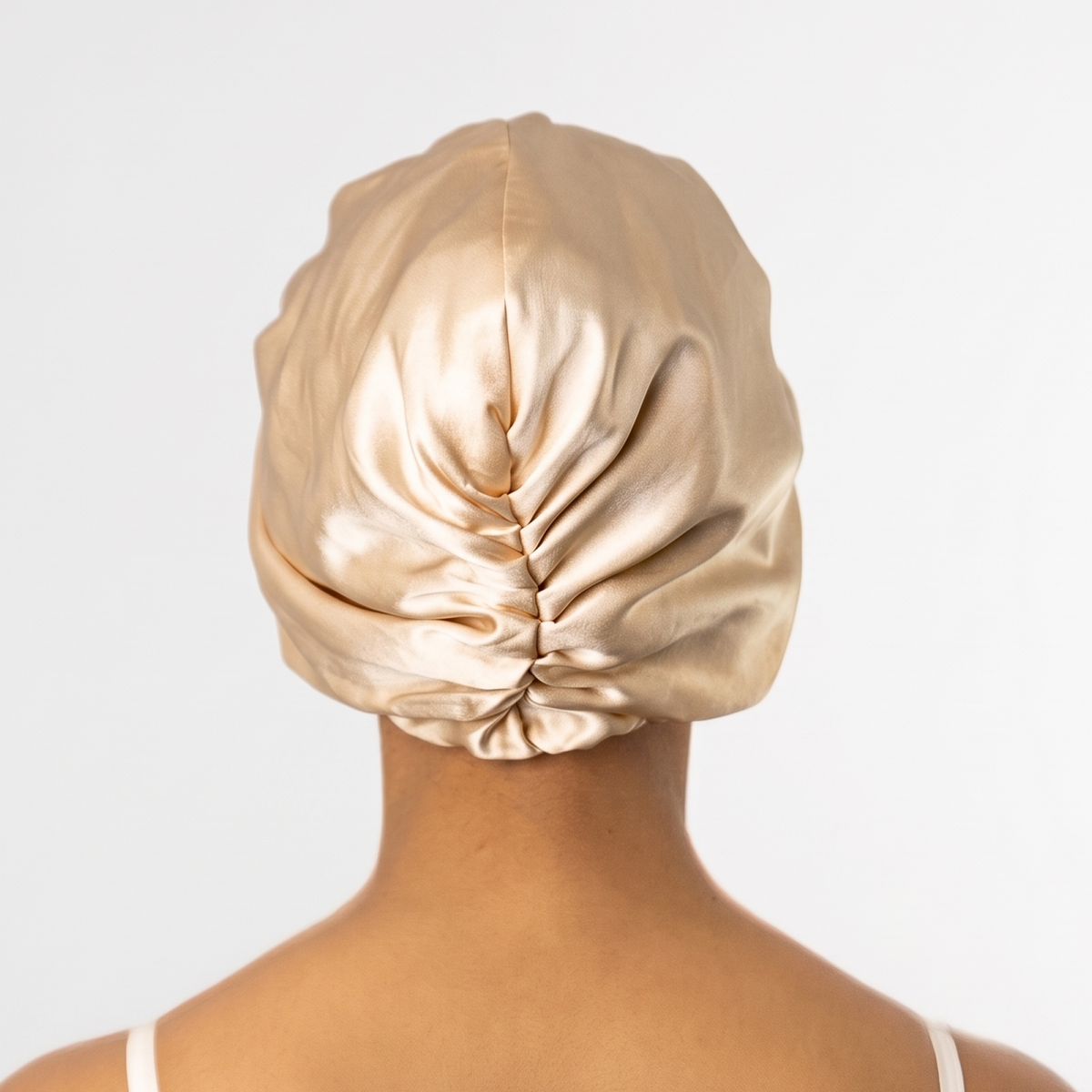 Back view of the champagne organic silk hair bonnet showing full coverage